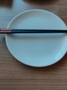 Empty Plate and Chopstik on The Table Royalty Free Stock Photo
