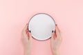 Empty plate in female hands mockup Royalty Free Stock Photo