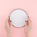 Empty plate in female hands mockup Royalty Free Stock Photo