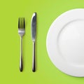 Empty plate, fork and knife