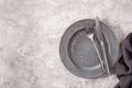 Empty plate fork knife on concrete background Royalty Free Stock Photo