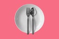 Empty plate fork spoon on a color background Royalty Free Stock Photo