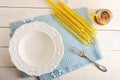 Empty plate and ingredients for cooking pasta Royalty Free Stock Photo