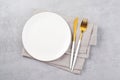 Empty Plate and Cutlery on Grey Concrete Background, Top View Royalty Free Stock Photo