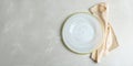 Empty plate and napkin on grey marble table, flat lay Royalty Free Stock Photo