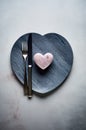 an empty plate with a pink heart on it and a fork and knife on the top Royalty Free Stock Photo