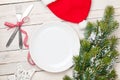 Empty plate, silverware and christmas tree Royalty Free Stock Photo