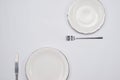 Empty plate and silverware set on wooden table. Top view. Royalty Free Stock Photo