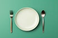 Empty plate with spoon and fork on green background. Top view. Generative AI Royalty Free Stock Photo