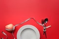 White plate, spoon fork, measure tape and apple on red background with copy space for text. Loss weight and healthy diet concept. Royalty Free Stock Photo