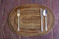 Empty plate with spoon, knife and fork on wooden natural backgro Royalty Free Stock Photo