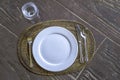 Empty plate with spoon, knife and fork on wooden natural backgro Royalty Free Stock Photo