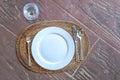 Empty plate with spoon, knife and fork on wooden natural backgro Royalty Free Stock Photo