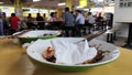 Empty plate on the table in a hawker center