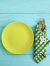 Empty plate of a towel rustic board summer on a blue wooden background daisy flower fork, knife Royalty Free Stock Photo