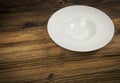 Empty Plate on White Wooden Table with Copy Space Royalty Free Stock Photo