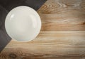 Empty Plate on White Wooden Table Top View with Copy Space Royalty Free Stock Photo