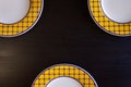 Empty Plates on Black Wooden Background