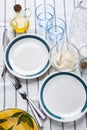 Empty plates with a blue border. serve a table. olive oil . spic Royalty Free Stock Photo
