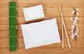 Empty plates, chopsticks and sakura branch Royalty Free Stock Photo