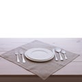Empty plates and cutlery tablecloth on wooden