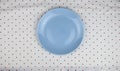 Empty plates on polka dot napkin. Setting table top view