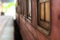 Empty platform of a railway station in Sri Lanka. Old rusty train cars. It looks like an abandoned place, but it is not Royalty Free Stock Photo