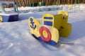 Empty playground for children on a frosty snowy winter day covered with snow without people. Russian playground. Maritime military Royalty Free Stock Photo