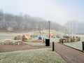 Empty playground a cold misty winter day Royalty Free Stock Photo
