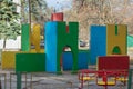 Empty playground made of colored concrete slabs in the day. A typical Soviet playground