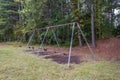 Empty playground swing set at the park