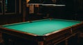 Empty pool table under overhead lighting ready for a game of billiards Royalty Free Stock Photo