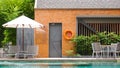 Empty poolside loungers with umbrellas Royalty Free Stock Photo