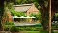 Empty poolside loungers with umbrellas Royalty Free Stock Photo