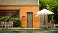 Empty poolside loungers with umbrellas Royalty Free Stock Photo