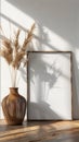 Empty poster frame against the wall in a bohemian interior setting Royalty Free Stock Photo