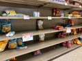 Empty potato chip display shelves at a Publix grocery store due to the people panicing and hoarding paper and food products Royalty Free Stock Photo