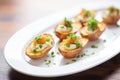 empty potato skins on a white plate with a parsley garnish Royalty Free Stock Photo