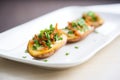 empty potato skins on a white plate with a parsley garnish Royalty Free Stock Photo