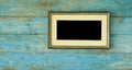 Empty precious handcrafted old frame with blank passepartout on rustic wooden wall, free copy space, mock-up