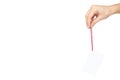 Empty price tag with red string in hand, isolated on white background. copy space template Royalty Free Stock Photo