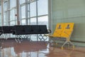 Empty priority seats in international airport reserved for disabled people. Normal and yellow disabled seats in the