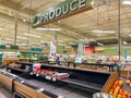 Empty produce department shelves at a Publix grocery store due to the people panicing and hoarding paper and food products