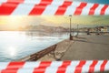 Empty promenade in Chania, Crete, Greece with warning tape