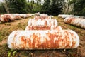 Empty propane storage tanks litter a field Royalty Free Stock Photo