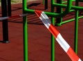 Red and white hazard and barricade tape to prevent use of exercise park Royalty Free Stock Photo