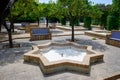 An empty public fountain dries up due to the drought shaped like an Arab star Royalty Free Stock Photo