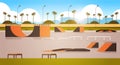 Empty public skate board park with various ramps for skateboarding cityscape background flat horizontal Royalty Free Stock Photo
