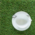 Empty pure white cup on the grasses background Royalty Free Stock Photo