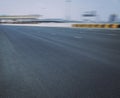 Empty race track road with skyline